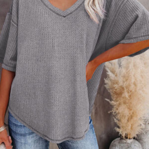gray exposed seam half sleeve knitted v neck textured top