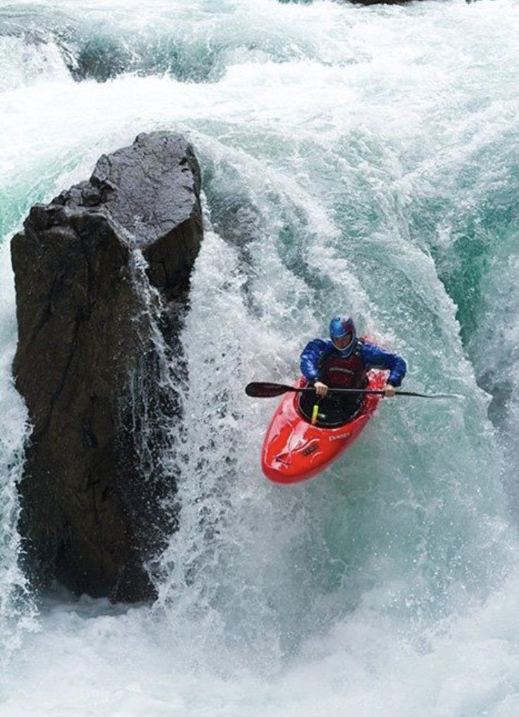 Kayaker Conquering Rapids